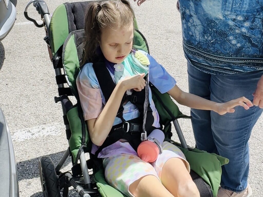 Replay sippy cup attached to adaptive stroller with BooginHead SippiGrip — sippy cups for special needs