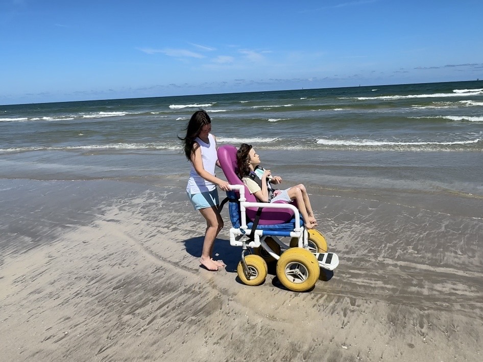 Loaner beach wheelchair with Purple Tomato Soft Sitter positioning insert at Mustang Island State Park