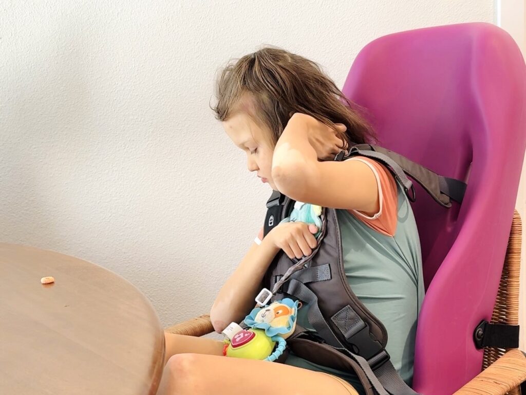 Child in Special Tomato Sitter size 4 at home — everyday adaptive seating for medically complex child